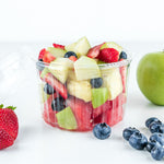 a fruit salad made with watermelon, pineapple, green apple, strawberry and blueberry