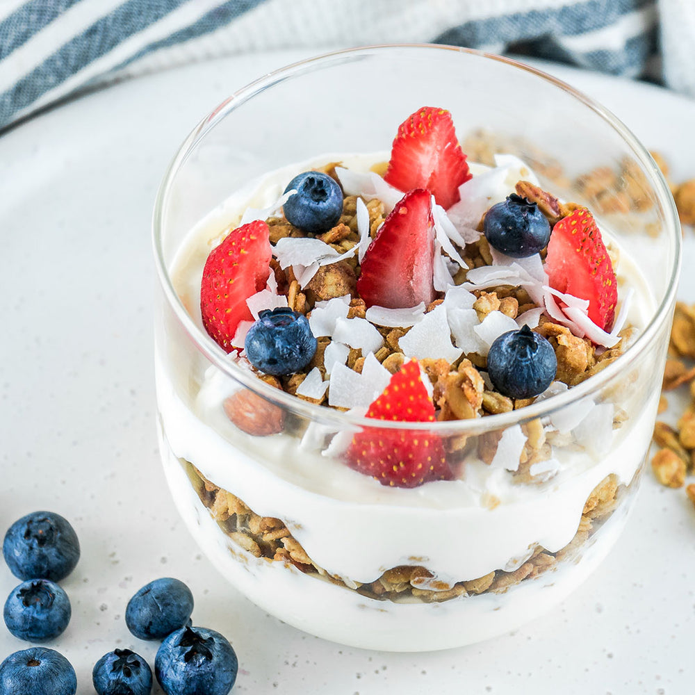 Yoghurt and Granola with blueberries and strawberries 